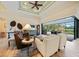 Spacious living room with sliding doors opening to the lanai at 31 Tee View Pl, Rotonda West, FL 33947