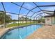 Screened pool and spa with lake view at 31 Tee View Pl, Rotonda West, FL 33947