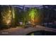 Relaxing lounge chairs by the pool at night at 31 Tee View Pl, Rotonda West, FL 33947