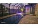 Night view of a relaxing pool and spa at 31 Tee View Pl, Rotonda West, FL 33947