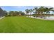 Grass lawn leading to the lake at 31 Tee View Pl, Rotonda West, FL 33947