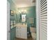 Small bathroom with single sink and toilet at 3300 Loveland Blvd # 3103, Punta Gorda, FL 33980