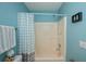 Bathroom with tub shower, and polka dot curtain at 3300 Loveland Blvd # 3103, Punta Gorda, FL 33980