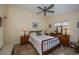 Spacious bedroom with a queen-size bed and ceiling fan at 3300 Loveland Blvd # 3103, Punta Gorda, FL 33980