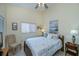 Bedroom with a full bed and coastal decor at 3300 Loveland Blvd # 3103, Punta Gorda, FL 33980