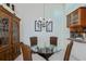 Charming dining area with glass table and wicker chairs at 3300 Loveland Blvd # 3103, Punta Gorda, FL 33980