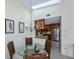 Bright dining area with glass table and kitchen view at 3300 Loveland Blvd # 3103, Punta Gorda, FL 33980