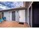 Exterior view showing the home's sliding glass doors and patio at 3300 Loveland Blvd # 3103, Punta Gorda, FL 33980