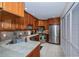 Modern kitchen with stainless steel appliances and wood cabinets at 3300 Loveland Blvd # 3103, Punta Gorda, FL 33980