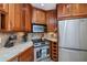 Kitchen features stainless steel appliances and ample wood cabinetry at 3300 Loveland Blvd # 3103, Punta Gorda, FL 33980