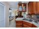 Open kitchen with stainless steel appliances and wood cabinets at 3300 Loveland Blvd # 3103, Punta Gorda, FL 33980