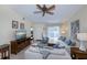 Comfortable living room with sectional sofa and TV at 3300 Loveland Blvd # 3103, Punta Gorda, FL 33980