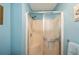 Clean shower with glass enclosure and shelf at 3300 Loveland Blvd # 3103, Punta Gorda, FL 33980