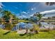 Serene waterfront backyard with lush greenery at 3404 Depew Ave, Port Charlotte, FL 33952