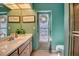 Bathroom with a unique stained-glass door, a single vanity, and tiled flooring at 3404 Depew Ave, Port Charlotte, FL 33952