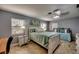 Spacious bedroom with a comfortable bed, a daybed, and ample natural light at 3404 Depew Ave, Port Charlotte, FL 33952