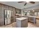 Modern kitchen featuring stainless steel appliances, a large island, and ample counter space at 3404 Depew Ave, Port Charlotte, FL 33952