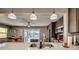 Modern kitchen with white countertops, pendant lighting, and stainless steel appliances at 3404 Depew Ave, Port Charlotte, FL 33952