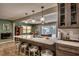 Updated kitchen with island seating, ample counter space, and view of dining area at 3404 Depew Ave, Port Charlotte, FL 33952