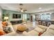 Spacious living room with two sofas and a view of the kitchen at 3404 Depew Ave, Port Charlotte, FL 33952