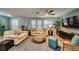 Living room with two sofas, ceiling fan, and tile flooring at 3404 Depew Ave, Port Charlotte, FL 33952