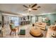 Open floorplan connects living area, dining space, and kitchen with view of pool at 3404 Depew Ave, Port Charlotte, FL 33952