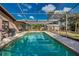 Screened-in pool, patio area, and grill at 3404 Depew Ave, Port Charlotte, FL 33952