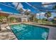 Screened-in pool and patio area with a view of the water at 3404 Depew Ave, Port Charlotte, FL 33952