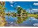 Scenic waterfront view with reflections of trees and sky at 3404 Depew Ave, Port Charlotte, FL 33952