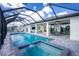 Inviting pool and spa with screened enclosure and patio at 3572 Como St, Port Charlotte, FL 33948