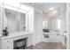 Bright, white bathroom featuring a vanity, soaking tub, and decorative ceiling at 3700 Candia Dr, Punta Gorda, FL 33950