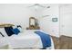 Spacious bedroom with plush carpeting, ceiling fan, and large closet at 3700 Candia Dr, Punta Gorda, FL 33950