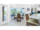 Breakfast nook with wicker chairs, a glass table, and pool views at 3700 Candia Dr, Punta Gorda, FL 33950