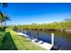 Backyard dock with access to a peaceful canal, perfect for boating enthusiasts at 3700 Candia Dr, Punta Gorda, FL 33950