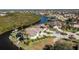 Waterfront home with dock, lush landscape, and mature trees at 3700 Candia Dr, Punta Gorda, FL 33950