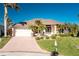 Front of house with landscaped front yard, double door entry, and double garage at 3700 Candia Dr, Punta Gorda, FL 33950