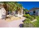 Front exterior view of a single-Gathering home with a double door entry, driveway, and lush landscaping at 3700 Candia Dr, Punta Gorda, FL 33950