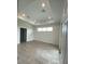 Spacious bedroom with tray ceiling and tile flooring at 384 Prineville St, Port Charlotte, FL 33954