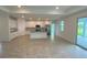 Bright and spacious kitchen with white shaker cabinets, a large island, and stainless steel appliances at 384 Prineville St, Port Charlotte, FL 33954