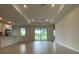 Open living area with sliding glass doors, tile flooring, and recessed lighting at 384 Prineville St, Port Charlotte, FL 33954