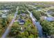 High angle shot of the home, yard, and adjacent canal at 4695 Kennett St, North Port, FL 34288