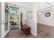 Bright foyer entryway with a view to the porch and open-concept dining area at 4695 Kennett St, North Port, FL 34288