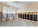 Unfinished bedroom with ceiling fan, window, and exposed framing at 48 Hibiscus Dr, Punta Gorda, FL 33950