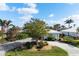 Charming front yard with mature trees and a well-manicured lawn at 48 Hibiscus Dr, Punta Gorda, FL 33950