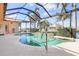 Enclosed kidney-shaped pool with a view of the canal at 5301 Almar Dr, Punta Gorda, FL 33950