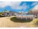 Backyard with above-ground pool and solar panels on the house at 5325 Cillette Ave, North Port, FL 34288