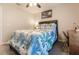 Bedroom with a queen bed, tropical bedding, and ceiling fan at 5325 Cillette Ave, North Port, FL 34288