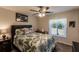 Bedroom with a queen-size bed, tropical bedding, and ceiling fan at 5325 Cillette Ave, North Port, FL 34288