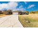 House exterior featuring a white garage door and landscaped lawn at 5325 Cillette Ave, North Port, FL 34288
