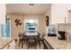 Kitchen with white cabinets, granite countertops, and stainless steel appliances at 5325 Cillette Ave, North Port, FL 34288